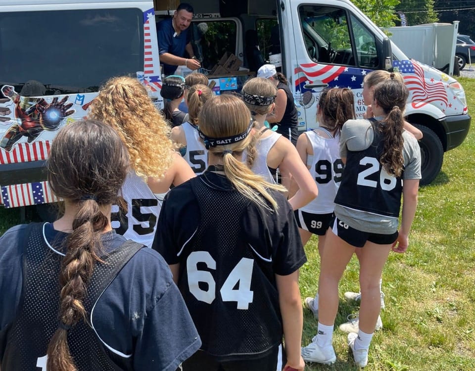 Ice cream truck serving happy families in Wellesley