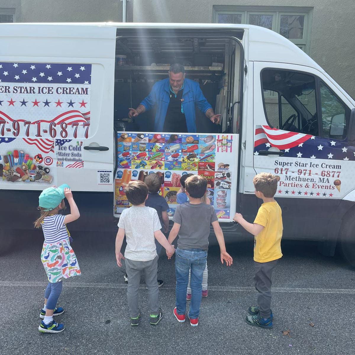 Ice cream truck serving students at a school event in Burlington