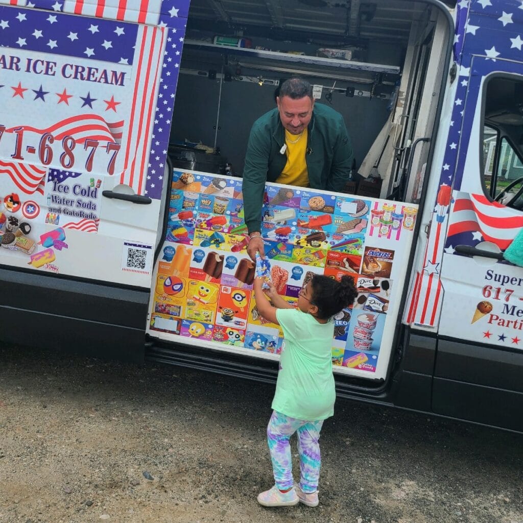 Ice cream truck at charity fundraiser serving guests