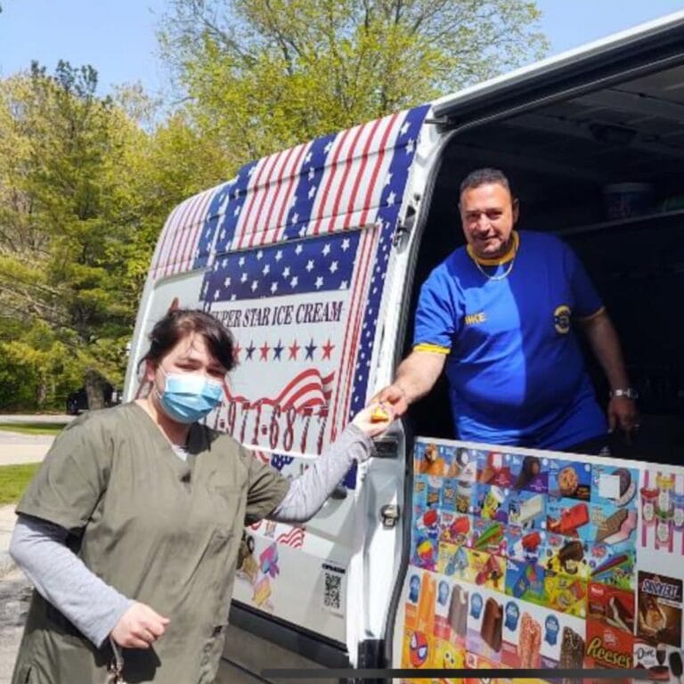 Colorful ice cream truck parked at a party