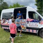 Ice cream truck serving kids at a youth sports event