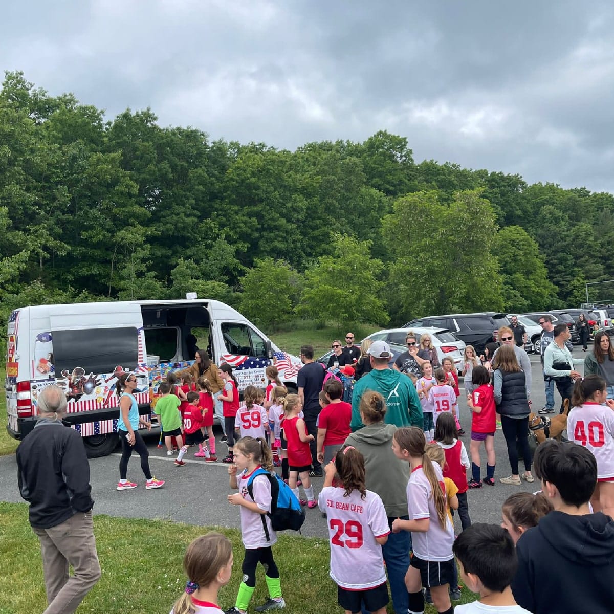Ice cream truck serving players and spectators at a Wellesley sporting event
