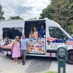Colorful ice cream truck serving guests at an outdoor event in Milton, MA
