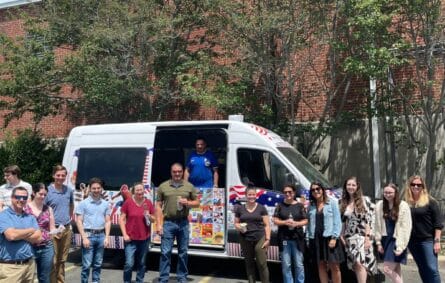 Ice cream truck in Boston serving a crowd at a summer event
