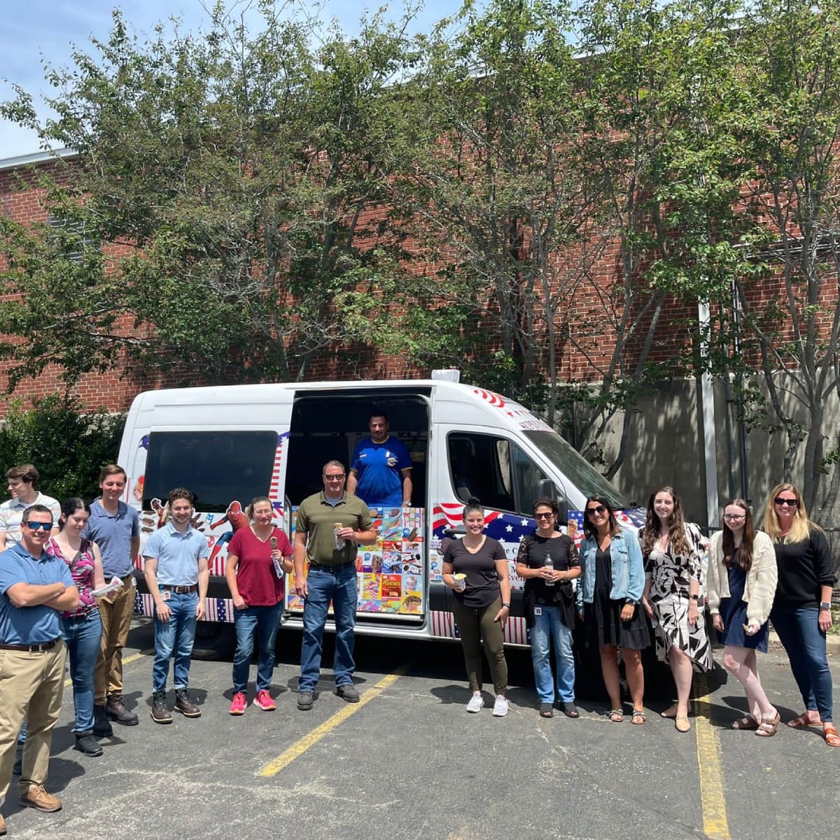 Ice cream truck in Boston serving a crowd at a summer event