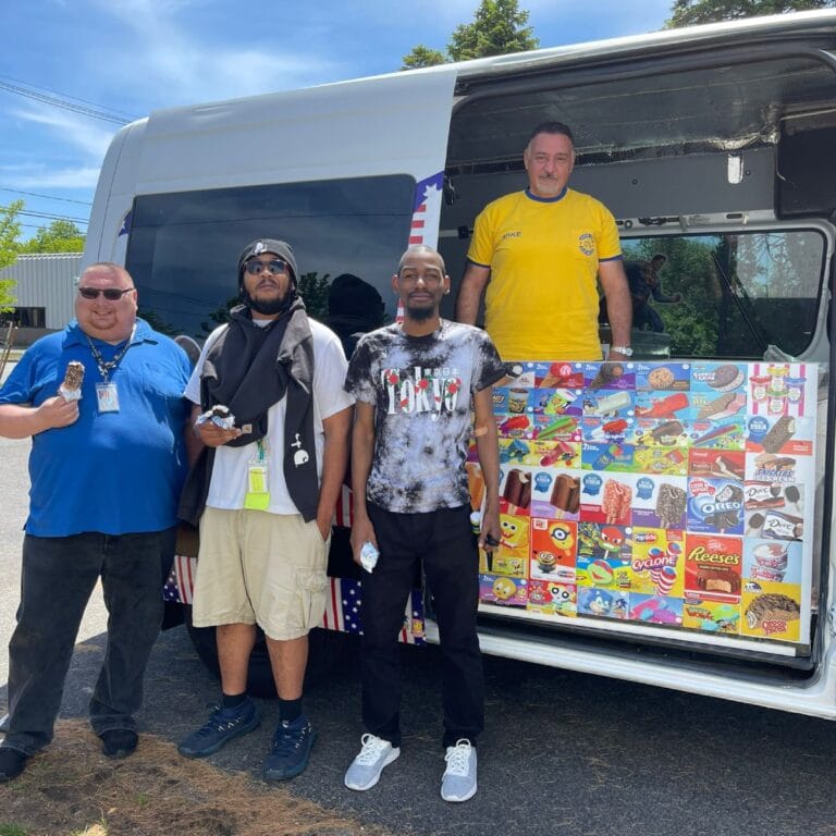Colorful ice cream truck parked at outdoor event in Massachusetts