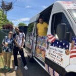 Ice cream truck serving guests at a lively backyard party
