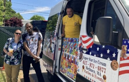 Ice cream truck serving guests at a lively backyard party