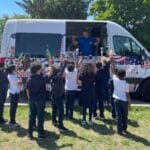 Ice cream catering truck serving guests at outdoor event