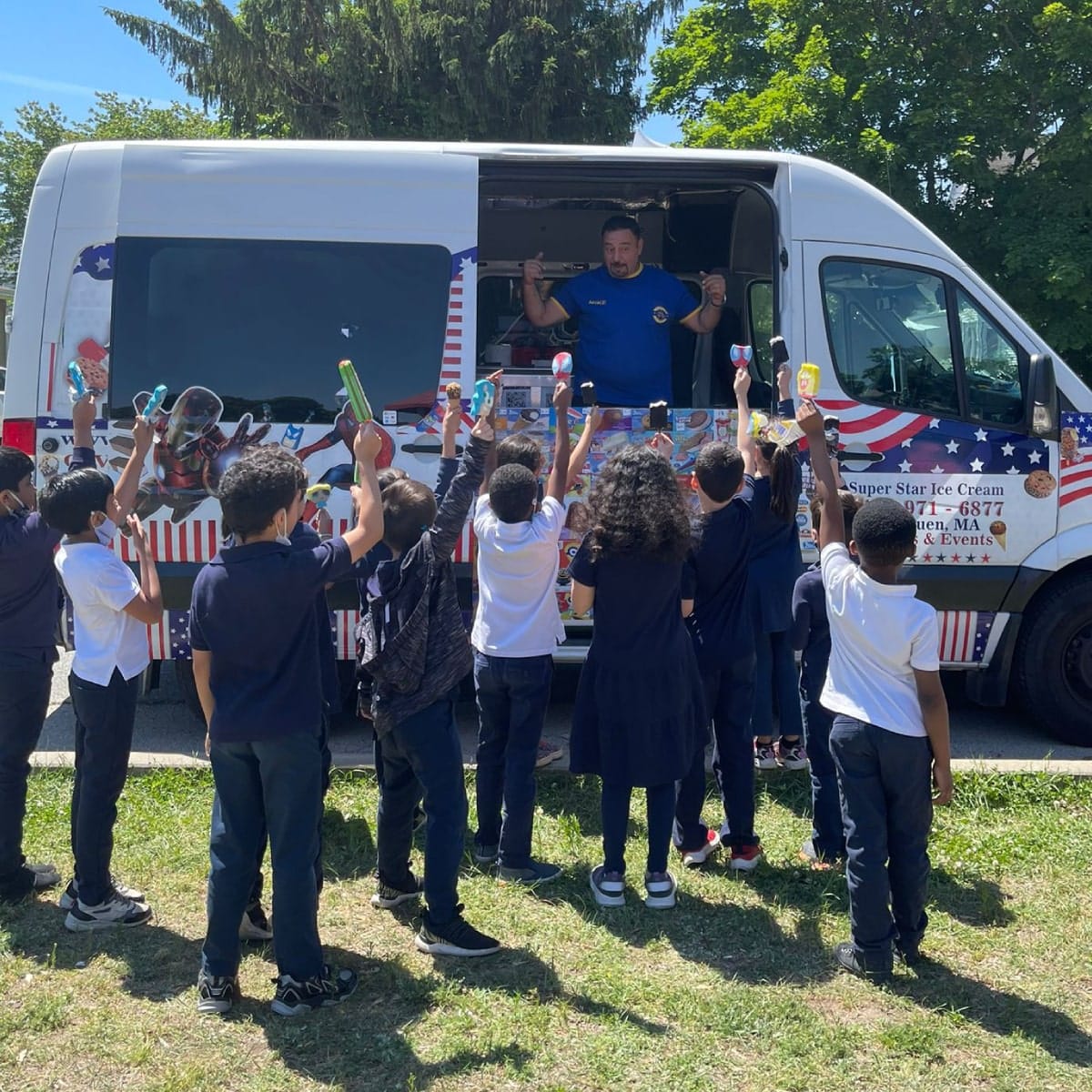 Ice cream catering truck serving guests at outdoor event