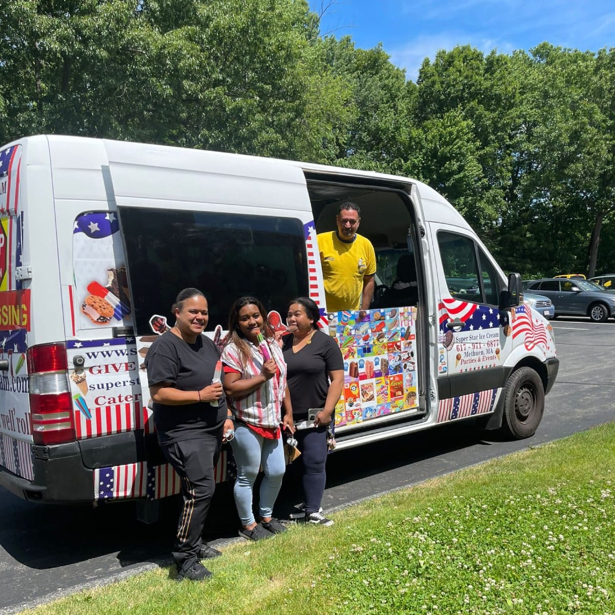 Ice cream truck in Dedham Massachusetts with SUPER STAR ICE CREAM serving families