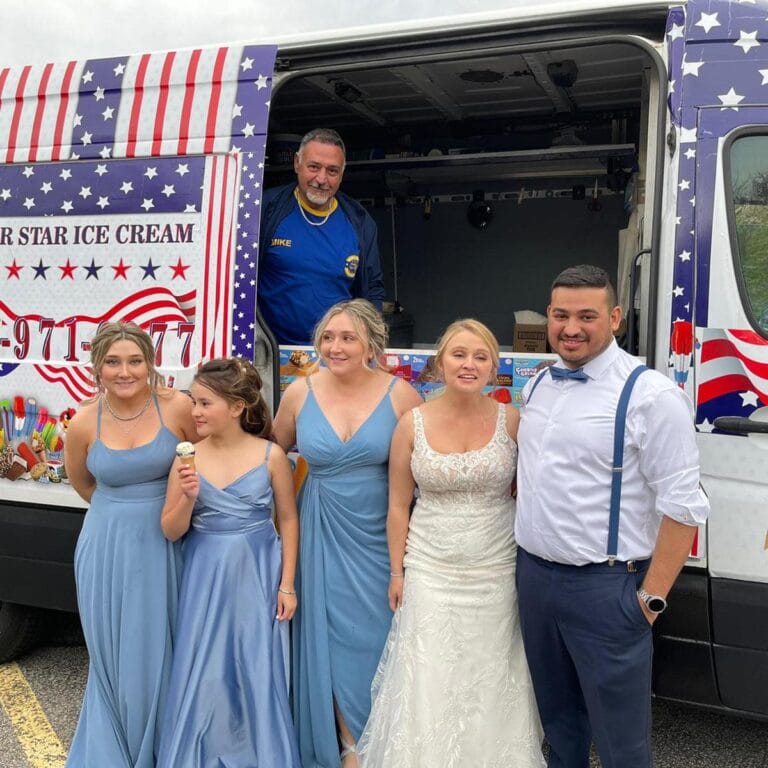 Ice cream truck at an outdoor wedding celebration serving guests