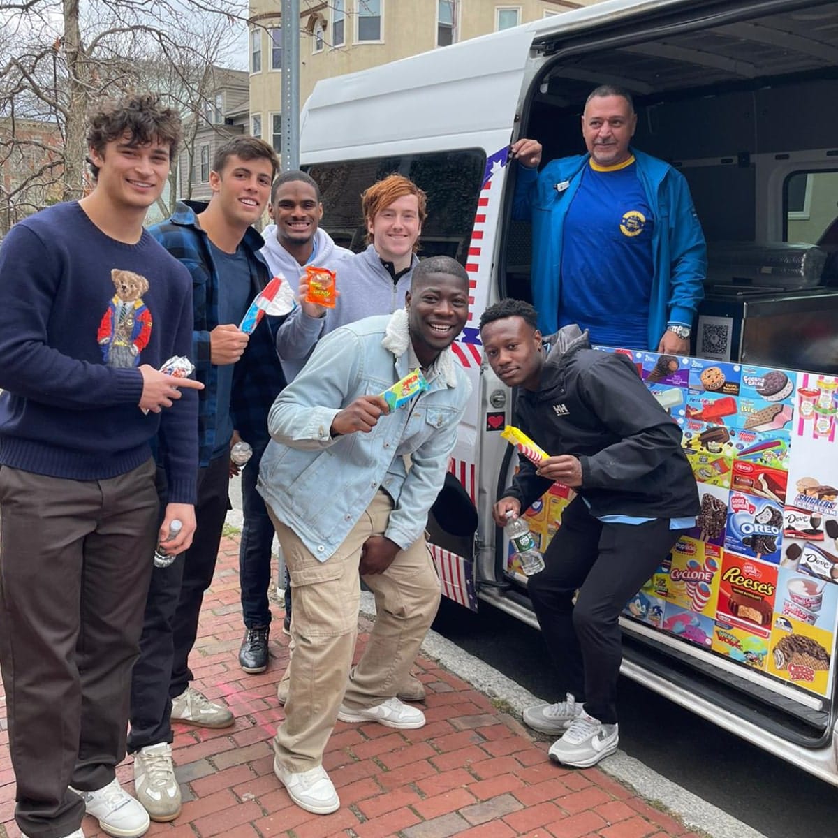 Young people enjoying ice cream from a mobile truck in Tewksbury