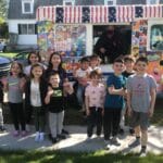 Ice cream truck serving guests at a Lawrence MA event for Ice Cream Truck Rental Lawrence MA