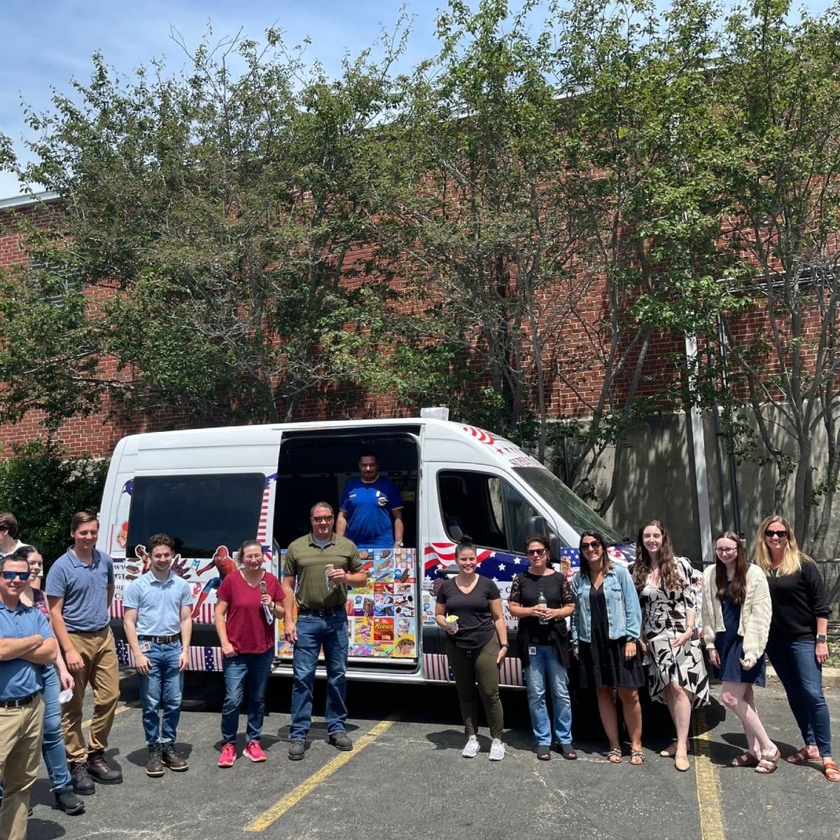 Colorful ice cream truck serving kids at a birthday party in Randolph