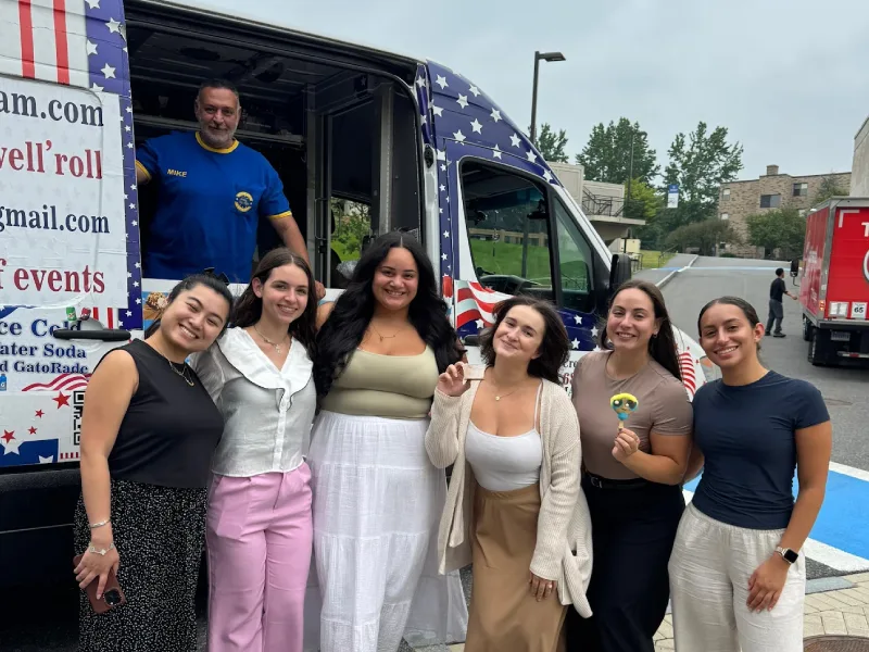Happy customers enjoying Super Star Ice Cream Truck at a party event in Massachusetts