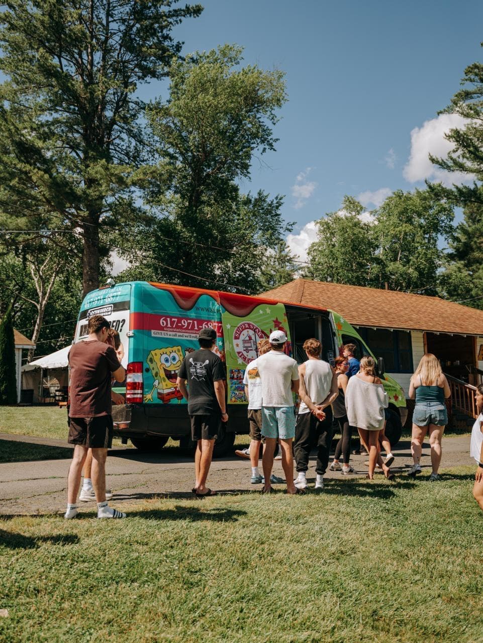 Ice Cream Truck Rental in Danvers MA serving a birthday party with children and families enjoying frozen treats outdoors