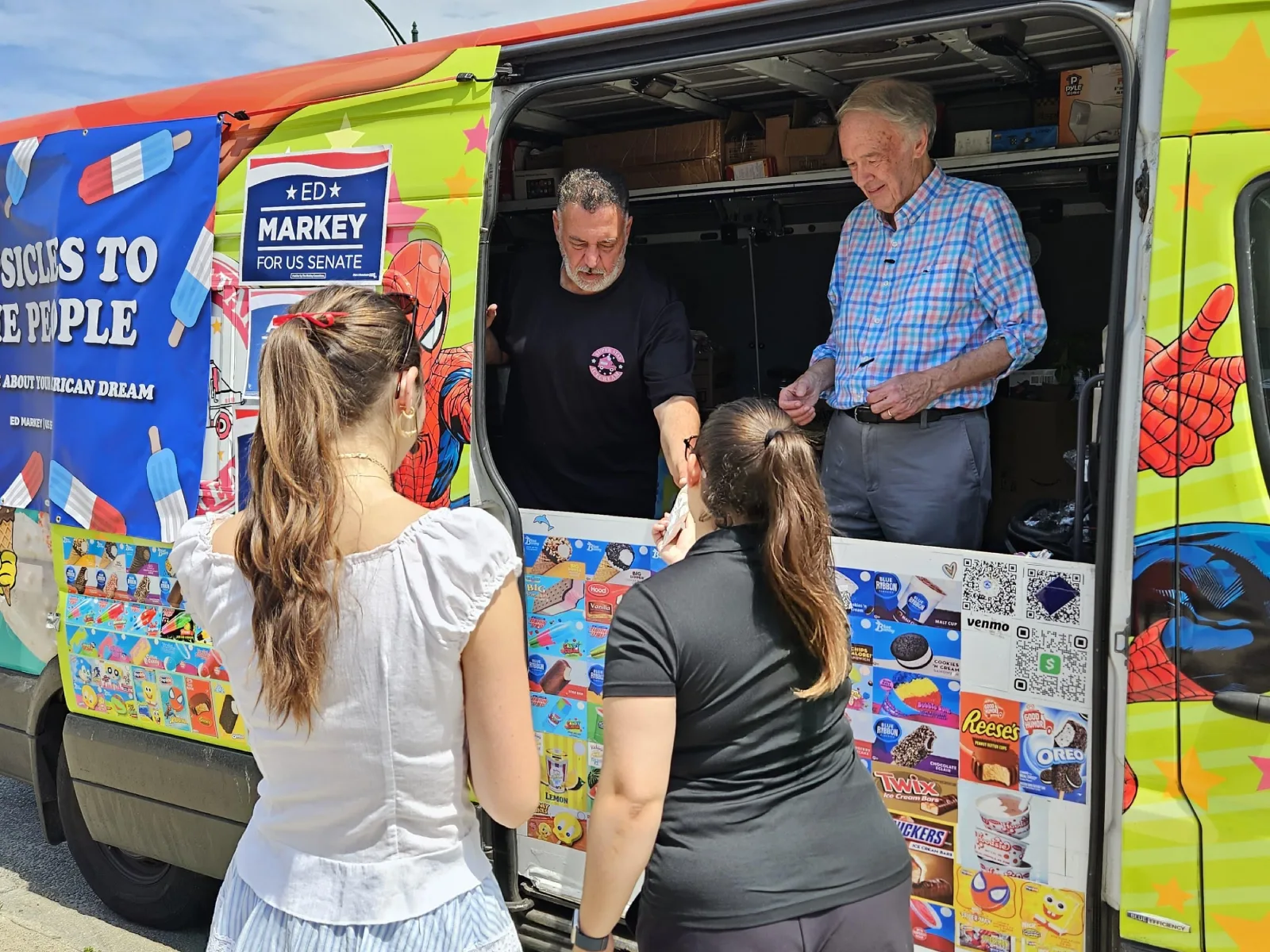 Super Star Ice Cream Serving Guests at a Community Event Super Star Ice Cream team serving guests from the ice cream truck during a local community event in Massachusetts.