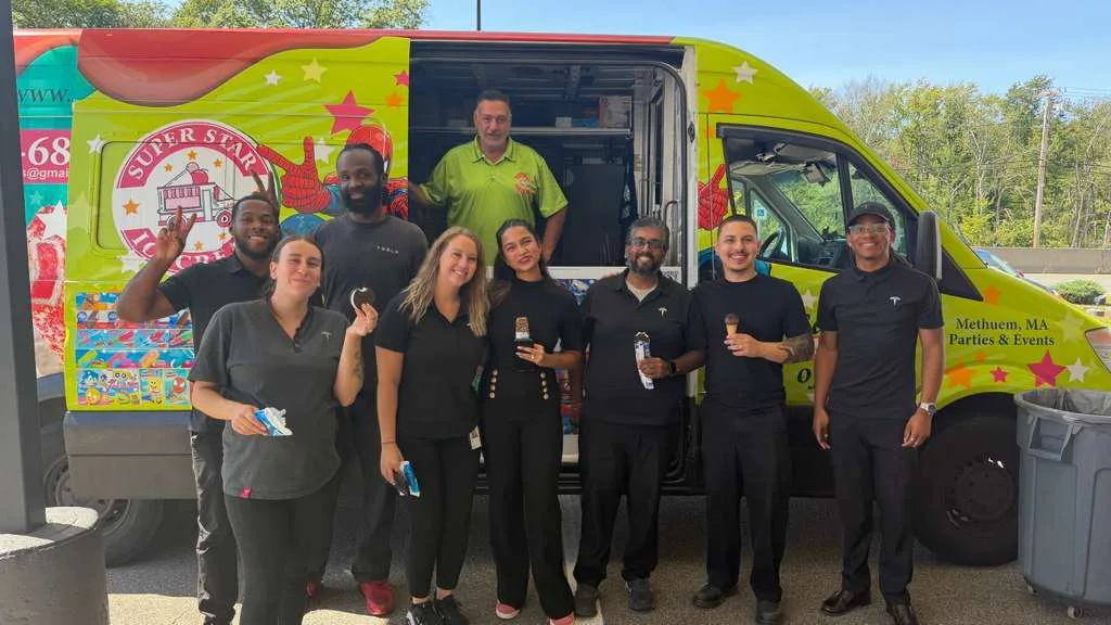 Super Star Ice Cream Serving a Tesla Event in Dedham Tesla team members with the Super Star Ice Cream truck during a corporate customer event in Dedham Massachusetts.